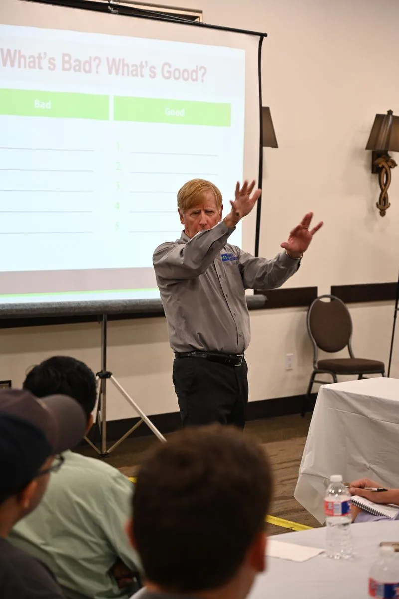 Balmert instructor pointing toward course material